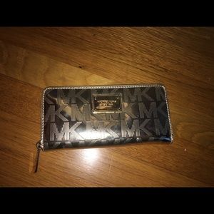 Michael Kors Gold wallet.